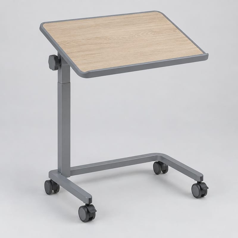 A grey rolling bedside tray table with a tilted wood-effect top and a C-shaped base